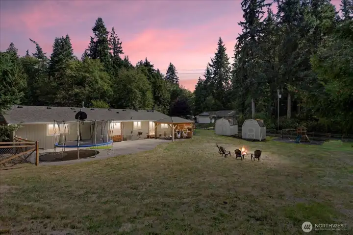 Twight light shot of backyard & firepit.