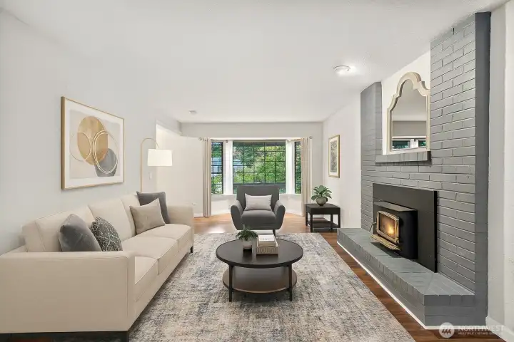 **Virtually Staged Living room- Bay window perfect for a reading area and enough space for a cozy family room set up by the fireplace.