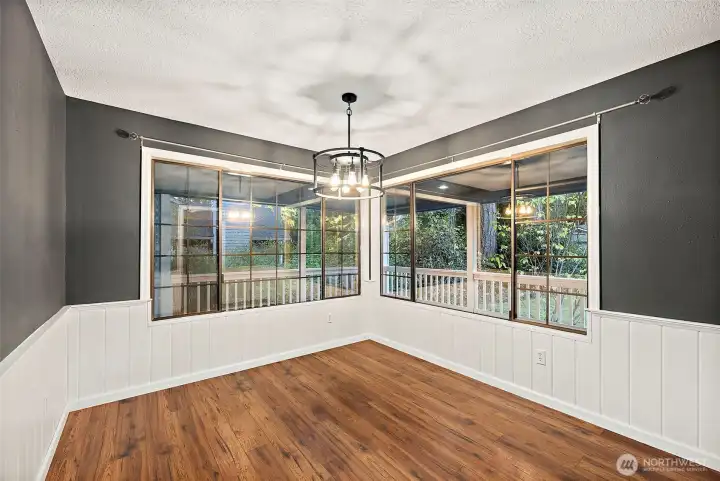 Dining room overlooking back deck and yard.