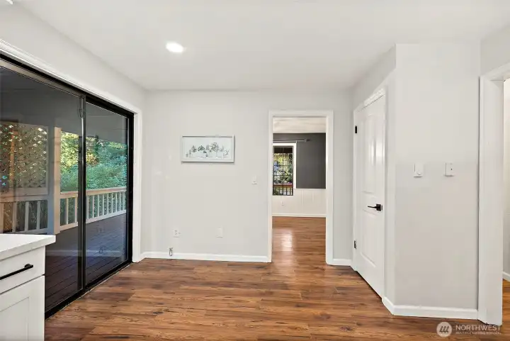 Large sliding door off kitchen brings you out to the side deck.