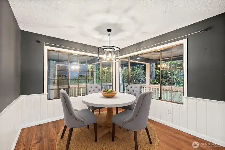 **Virtually Staged Dining room overlooking back deck and yard.