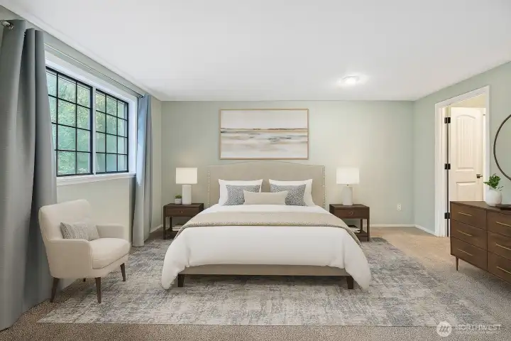 **Virtually Staged Primary Bedroom with a window looking out to front yard and bringing in the morning light.