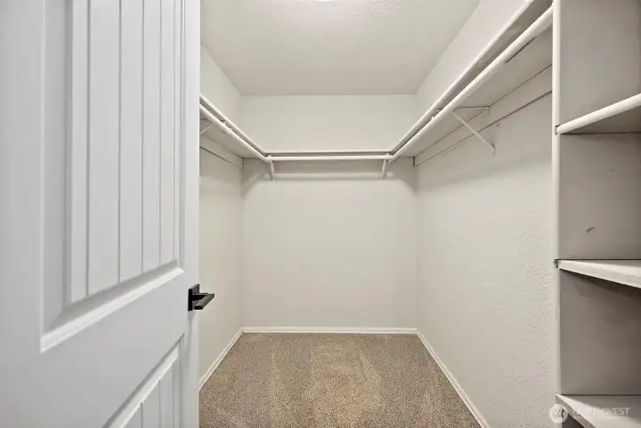 Primary bedroom walk-in closet