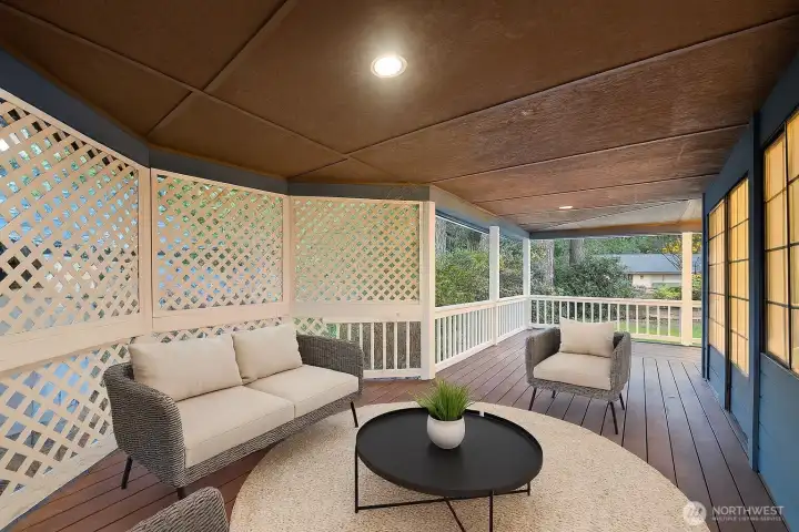 **Virtually Staged Covered side deck that wraps around from front porch to back deck, with some privacy screening from the neighbors. Access off kitchen via sliding glass door.