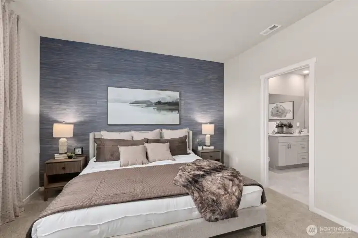 Primary bedroom 1 with connected primary bath. Actual home is under construction. Colors, materials, and features may vary. See site agent for details.