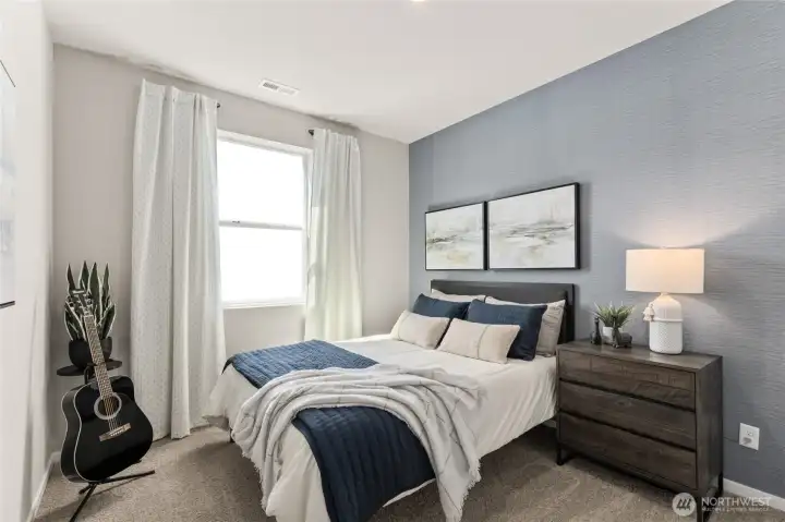 Bedroom 2 can accommodate a queen mattress and more for your guests. Actual home is under construction. Colors, materials, and features may vary. See site agent for details.