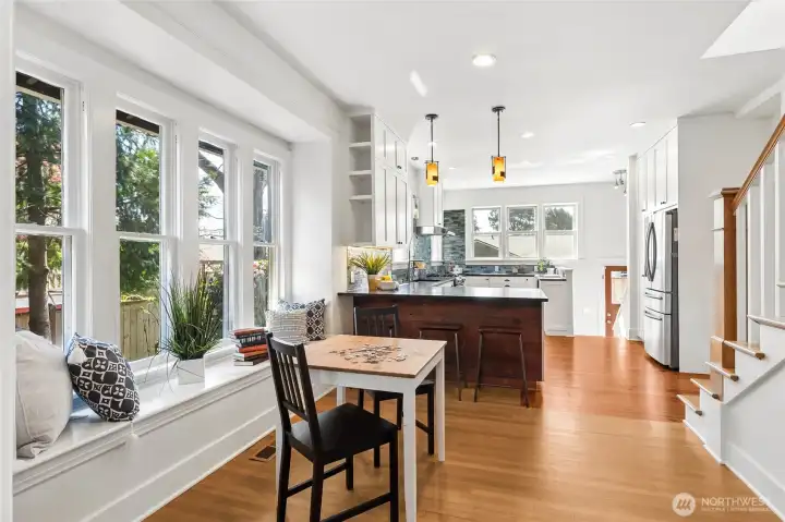 Open kitchen with multiple areas for sitting.