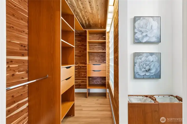 Custom closet with custom sized laundry hampers.