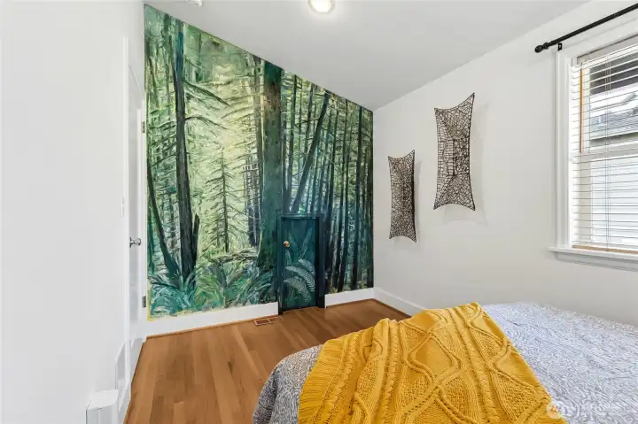 The mural has been with the home for many years and the secret door goes to the bathroom.