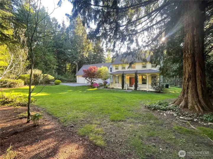 Lucious grounds surrounds this beautiful house and 3-car garage with storage space above!