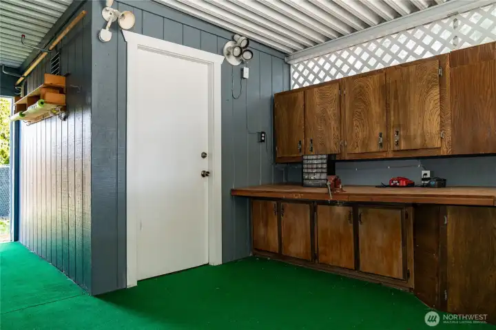 Work bench and dry storage room.