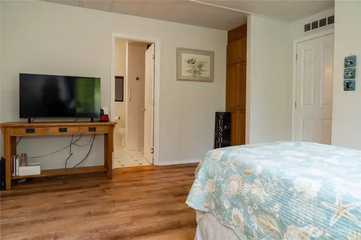 Primary bedroom looking into bathroom.