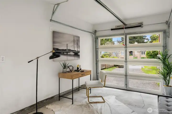 Finished and insulated garage doubles as office/gym space.