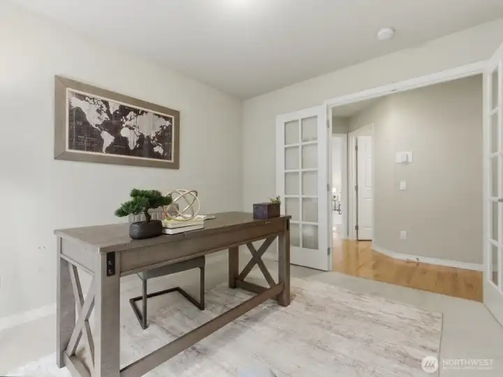 Office/den with French doors on the main floor, tucked away would make for a great home office