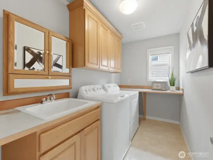 Large laundry room is conevienienlty located upstairs