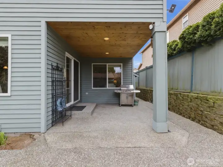 Large covered patio perfect for year-round enjoyment. Gas Grill connected and conveys with the home