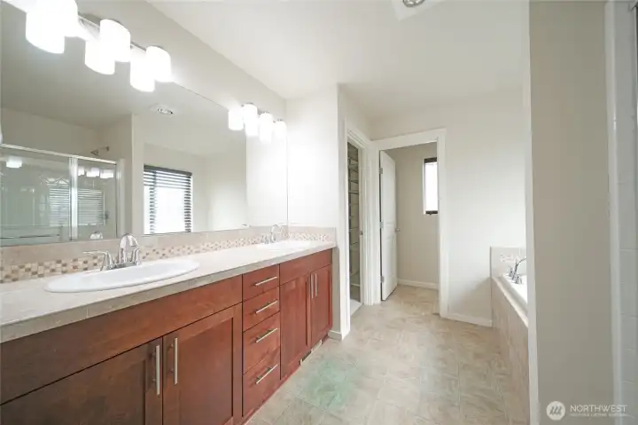 A 5 piece en-suite bath with dual vanities, standalone shower, soaking tub, and toilet with it's own door. A 5 piece en-suite bath with dual vanities, standalone shower, soaking tub, and toilet with it's own door.