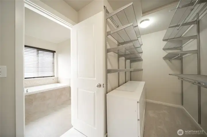 Custom walk-in closet designed by Classic Closets Custom walk-in closet designed by Classic Closets