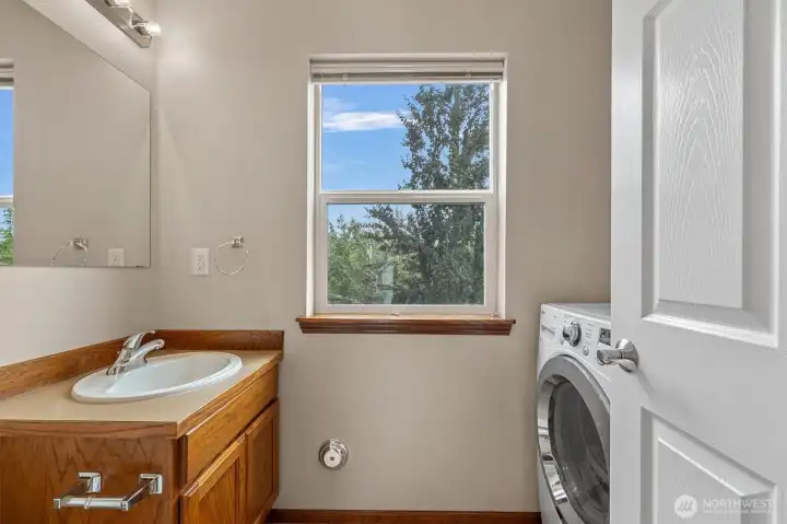2nd floor half bath with laundry room, washer and dryer included.
