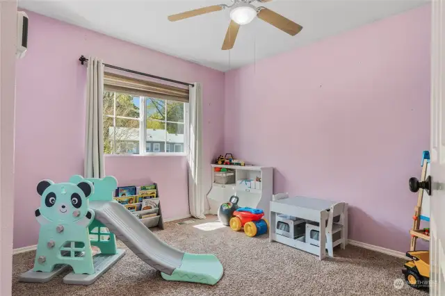 Fourth bedroom with large window and ceiling fan/light.  Makes a great play room.