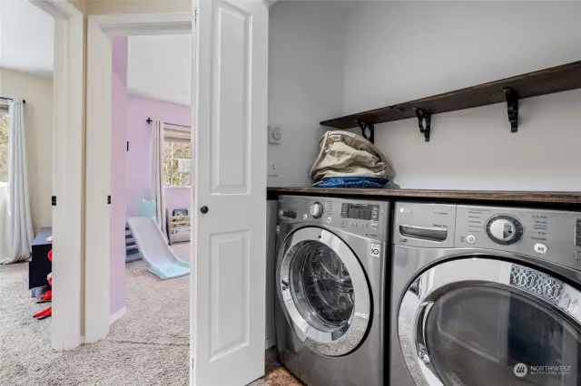 Upper level features large washer & dryer - both stay with the house.