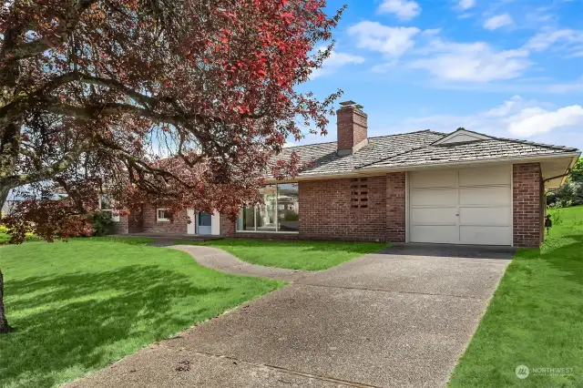 Traditional solid brick rambler, one car garage.