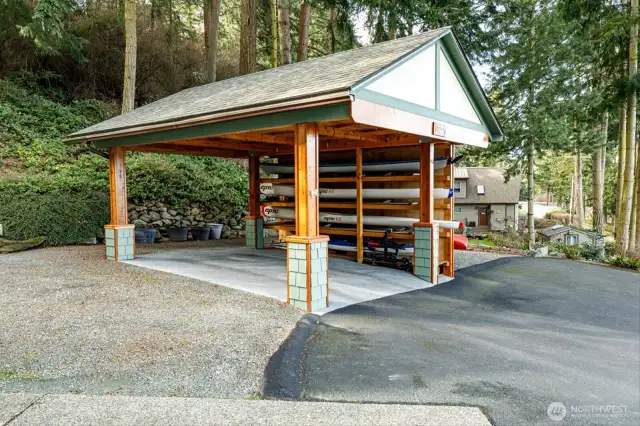 Detached carport has 4 kayak storage rack