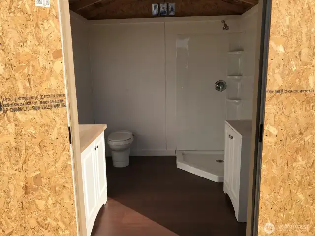 Bath house. Shower, sink, toilet.
