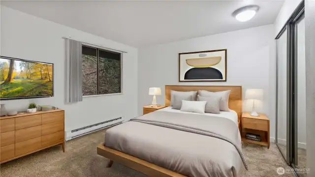 Sizable guest bedroom with a mirrored closet. Notice the privacy through the window!? If you're looking for a private unit this is it! **Virtually Staged**