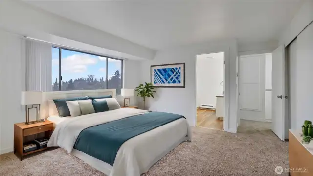 Upper level primary bedroom with a spacious full bath and large window that gives this room a light & bright feel. **Virtually Staged**