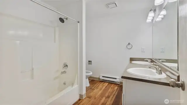 Spacious primary ensuite with dual sinks.