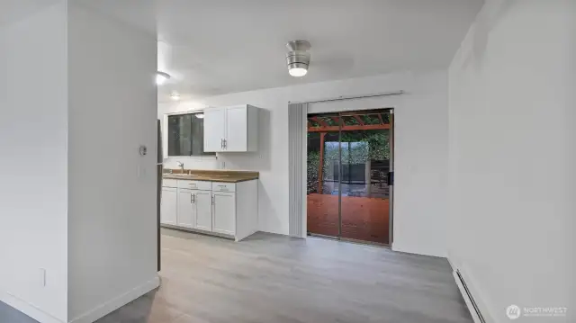 From the dining area enjoy the ambiance of the wood burning fireplace & the abundance of natural light.