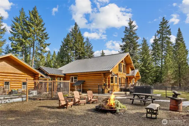 This backyard has it all. Multiple garden spaces, firepit, hot tub, deck and so much more!