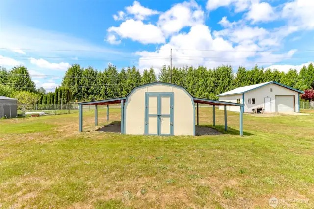 Here's the storage shed for your lawn equipment, and more covered space on either side.