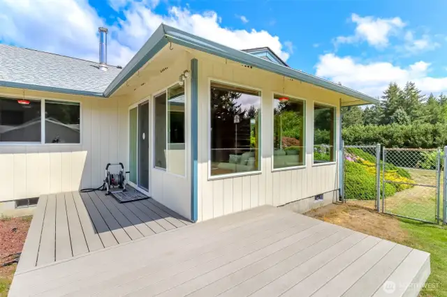 A close-up view of the deck and sunroom.