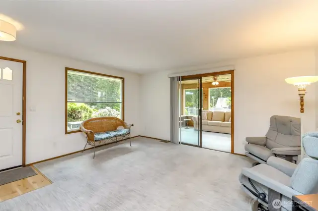 Front door to the left; door to the sunroom to the right.