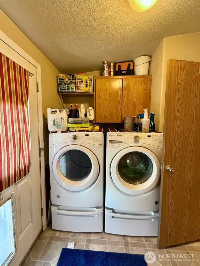 Laundry Room with direct access to the backyard and guest bathroom