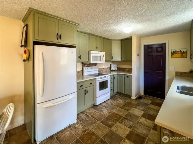 Updated Kitchen with access to Garage and Back Deck