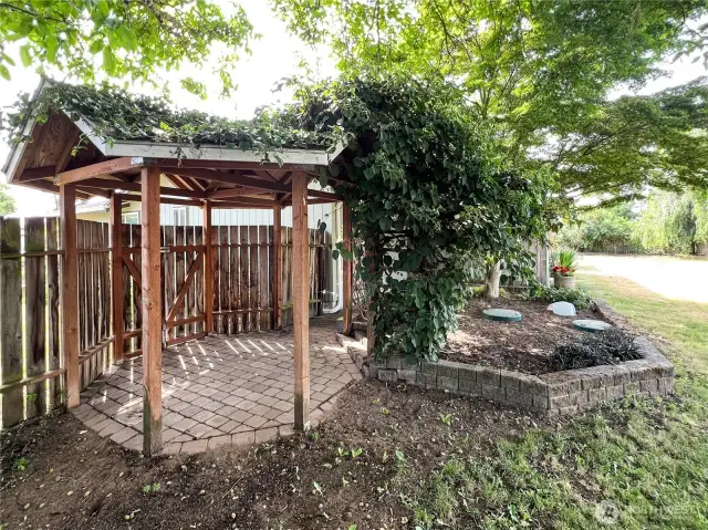 Backyard Gazebo with mature trees and vegetation