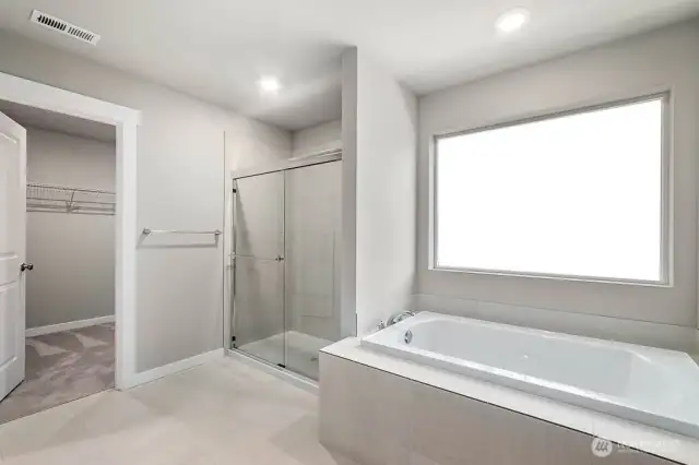 Our homes have free standing soaking tub not shown in this photo. Photos are for representational purposes only. Some colors and finishes may differ.