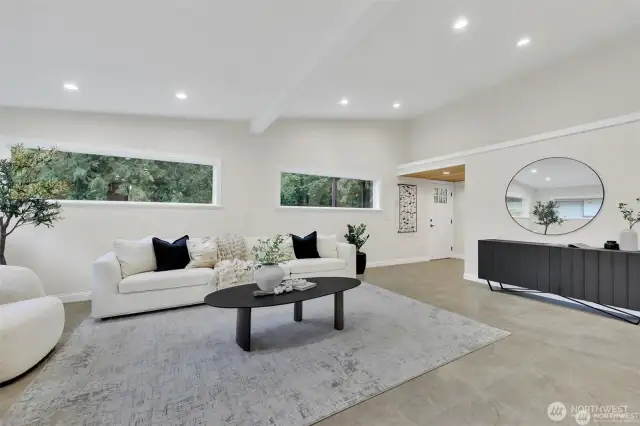 Bright and open living room with new flooring and paint.