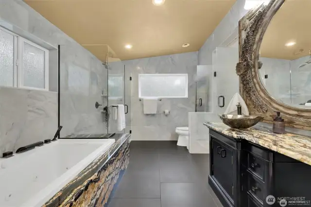 Freshly updated primary bathroom with modern finishes and a soothing spa-like feel.