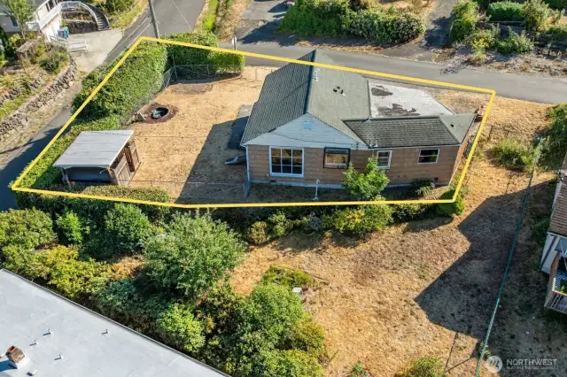 Highlighted aerial view showcasing the generous corner lot and existing home footprint—offering ample space and potential for future expansion, outdoor living, or redevelopment.
