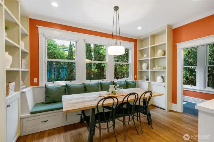 Built in bench seating with hidden storage adds both charm and function to this thoughtfully designed space