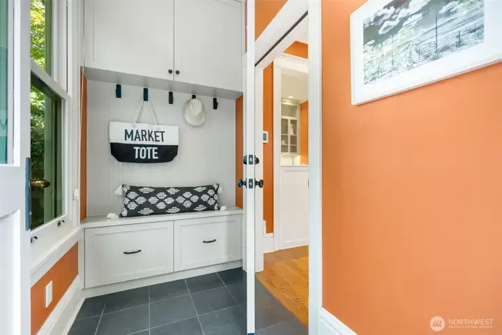 The generous mudroom at the back entry makes everyday living easy with built-in storage and cozy nooks for all the extras.