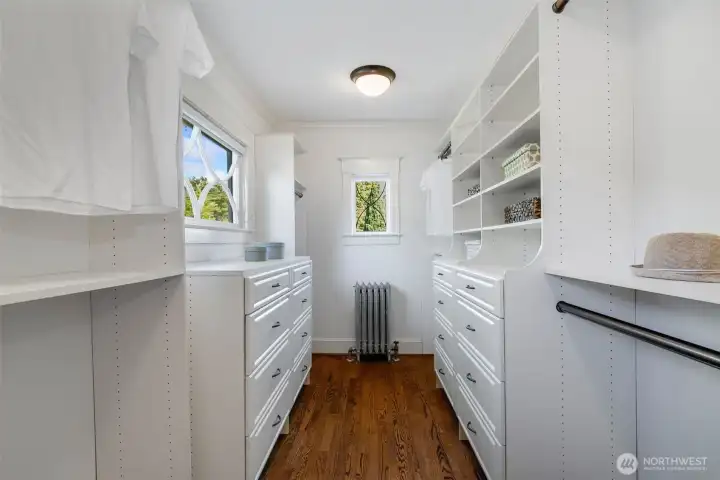 The primary closet has room for everything!