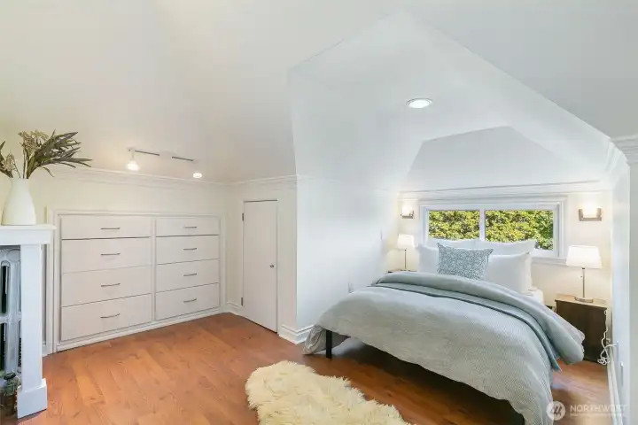 3rd floor bedroom has built in storage and lots of light