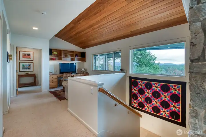 The stairway leads down to the other bedrooms and bonus room.