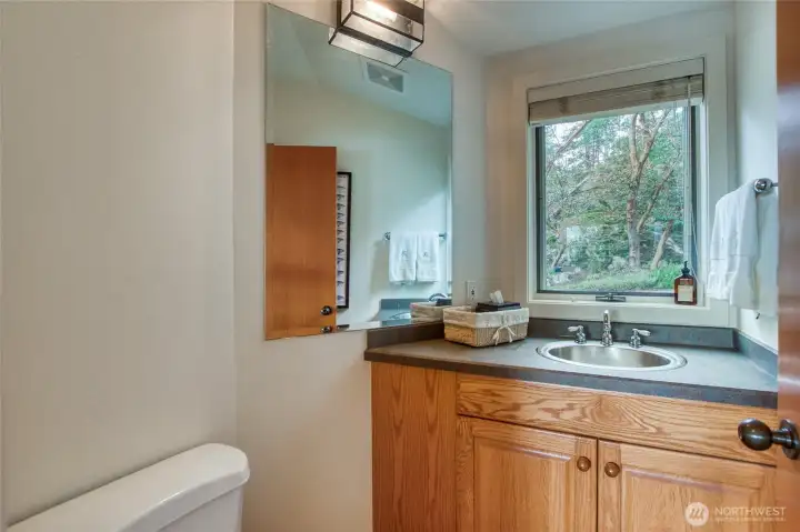 A convenient powder room is located on the main level.