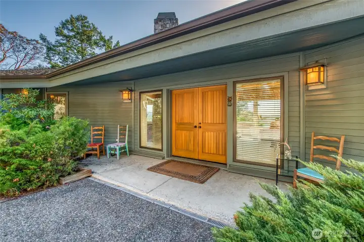 The entry french doors lead to the grand entrance of the great room.